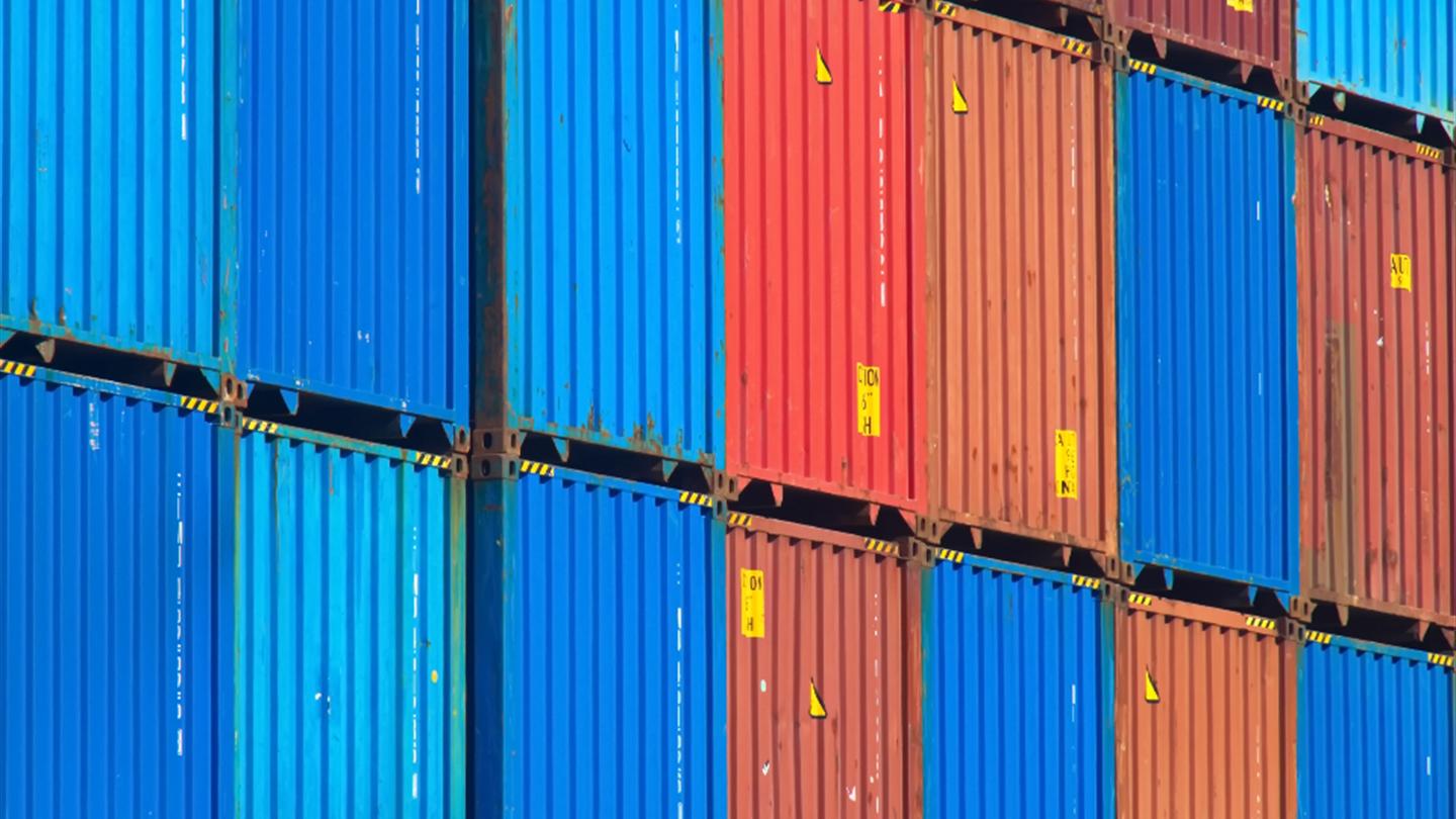 Shipping containers stacked at a terminal