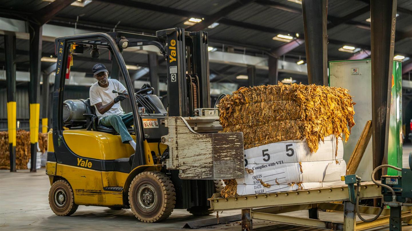 Forklift moving packaged industrial material