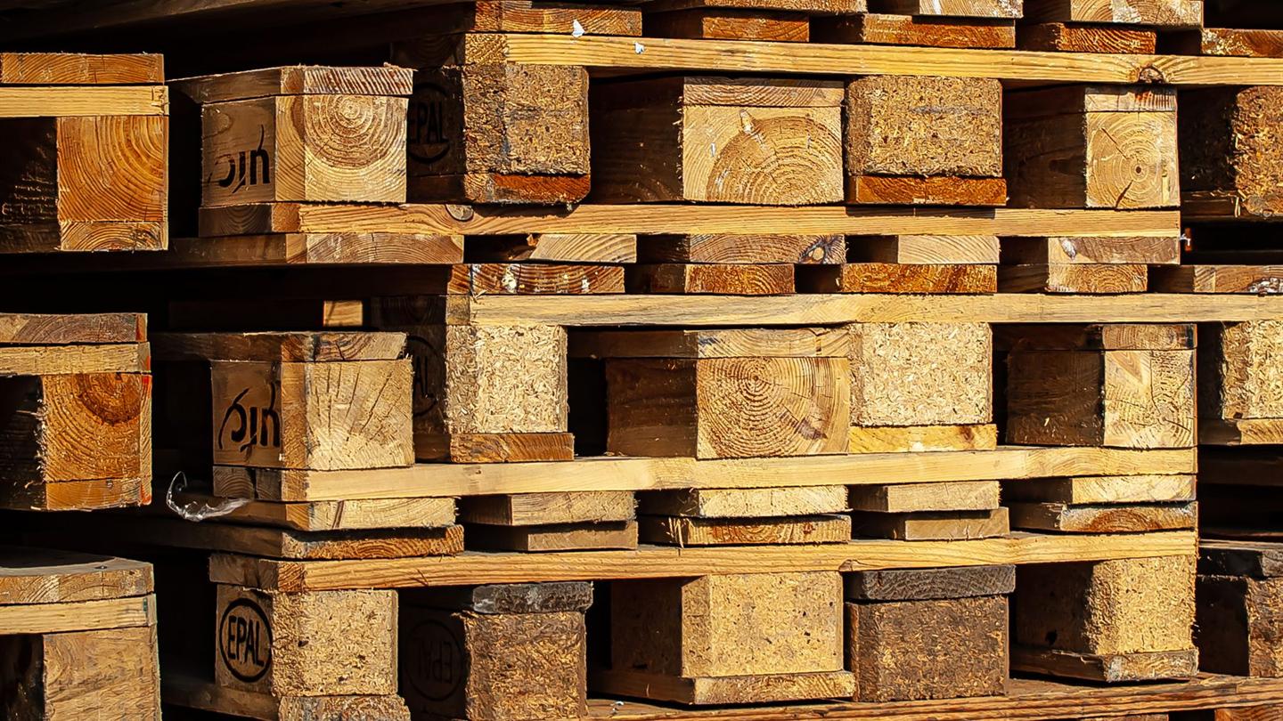 Stacked pallets in an industrial yard
