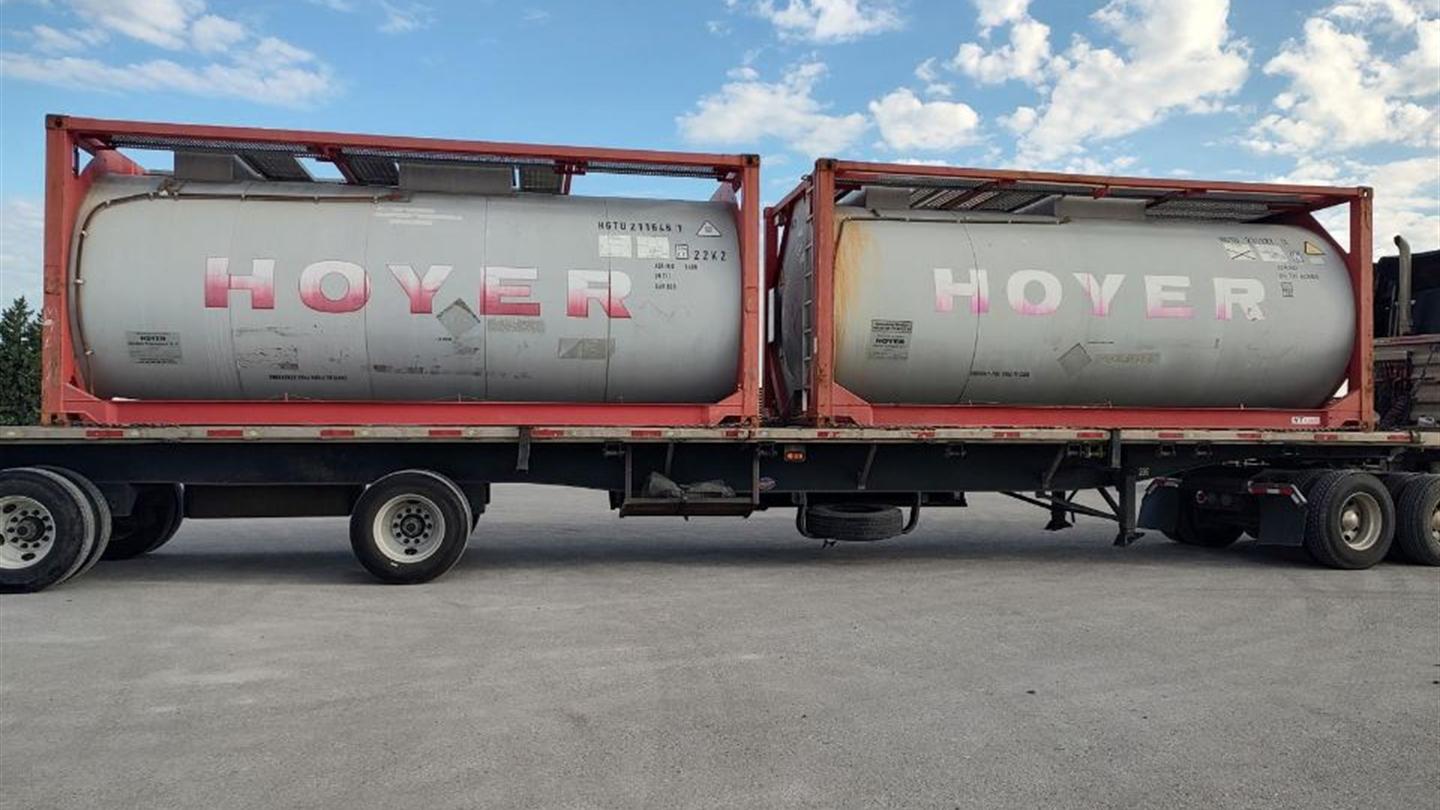 Tank containers in transit on a highway