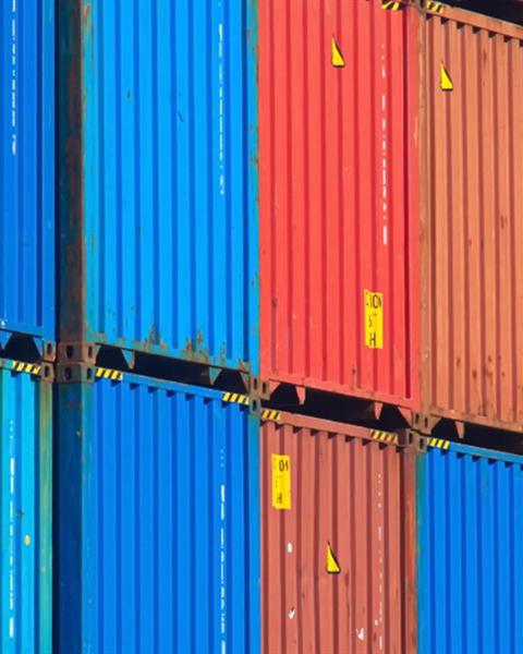 Shipping containers stacked at a terminal
