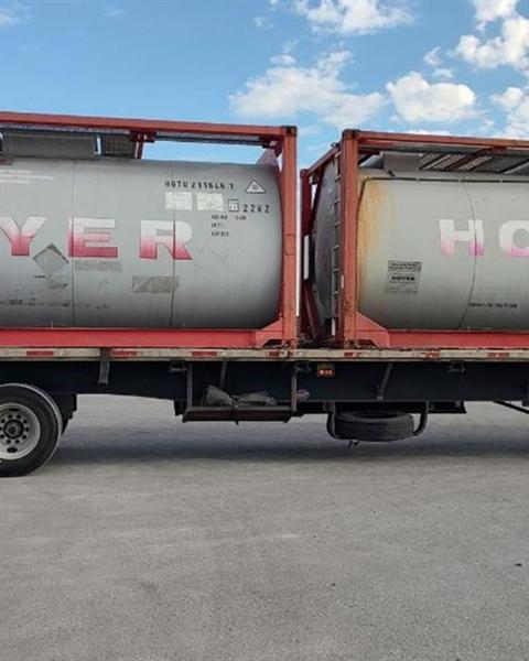 Tank containers in transit on a highway