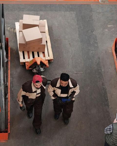 Workers preparing palletized shipments
