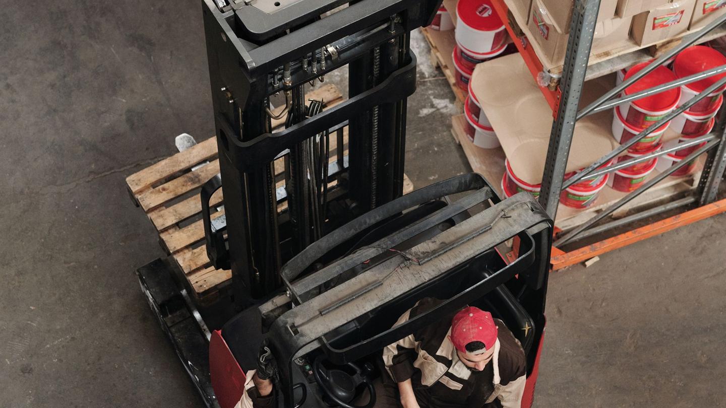 Logistics team reviewing a shipment on a warehouse floor