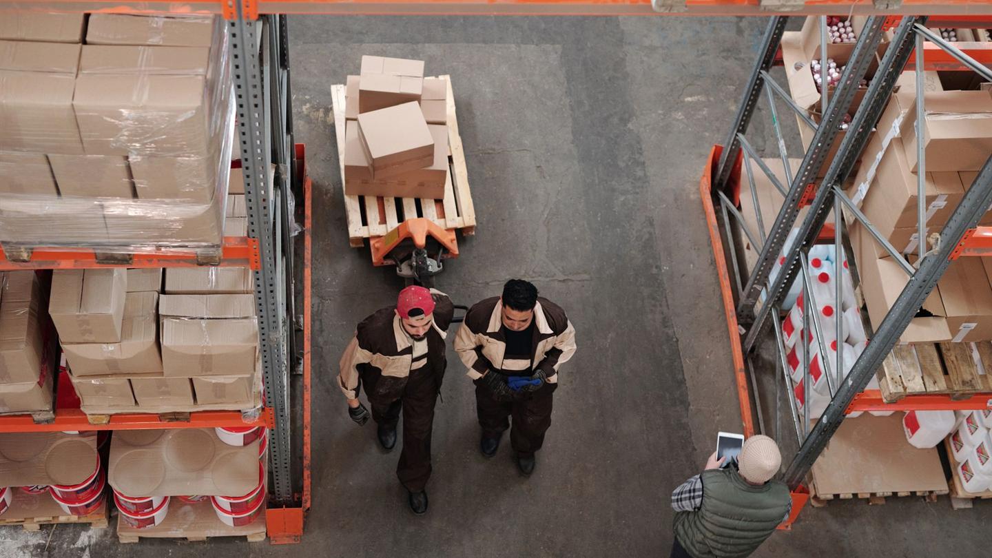 Workers preparing palletized shipments