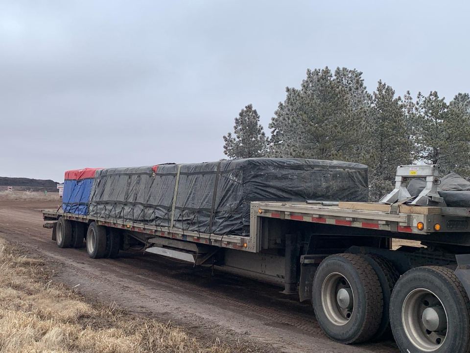 Tarped load on a step deck trailer