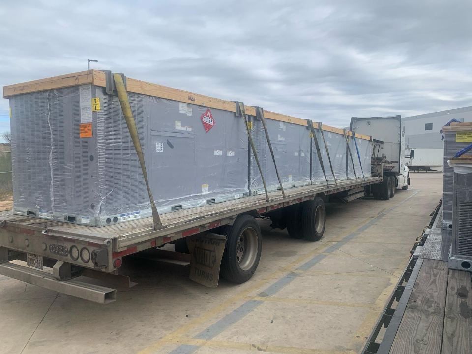 Protected commercial freight on an open trailer