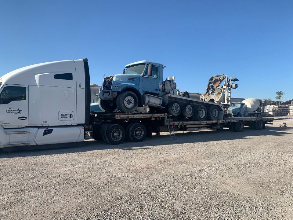 Day cab truck hauled on a specialized trailer