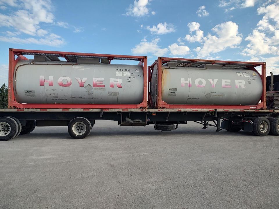 Tank containers in transit on a highway
