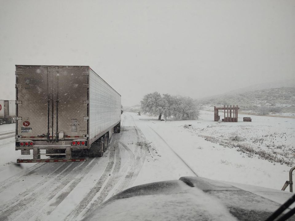Dry van trailer running a snowy winter route